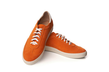 Orange casual suede shoes isolated on white