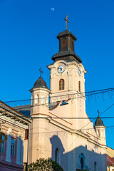 Building of St. George Church in Uzhhorod city, Ukraine. It is a Roman Catholic church built in 1762-1766 in a late Baroque style. City clock placed on the tower