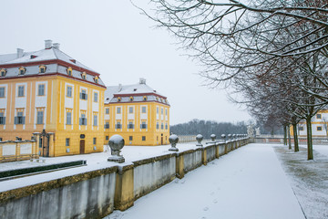 Naklejka na ściany i meble Schloss Hof, Austria - February 20, 2017:Schloss Hof is a baroque palace in Lower Austria, which privious owners include Prince Eugene of Savoy and Maria Theresia,with falling snow.