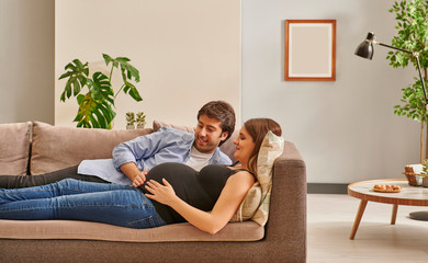 Pregnant woman and couple in the room, happy and waiting baby.