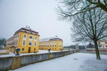 Fototapeta na wymiar Schloss Hof, Austria - February 20, 2017:Schloss Hof is a baroque palace in Lower Austria, which privious owners include Prince Eugene of Savoy and Maria Theresia,with falling snow.