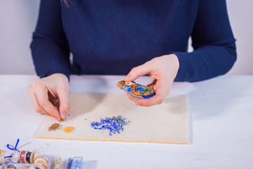 Designer making handmade brooch