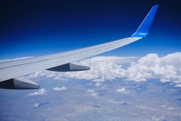 Plane horizon aerial view. Airplane wing sky view
