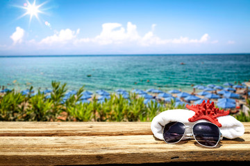 Desk of free space and summer beach background 