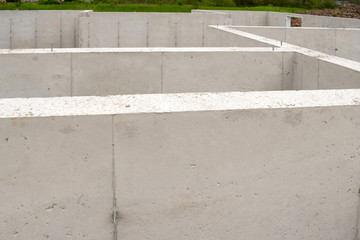 Fototapeta premium New Home House Construction Concrete Cement Foundation Basement Builders