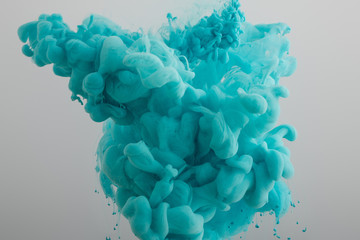 Fototapeta turquoise paint splash isolated on grey background obraz