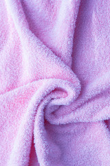 Texture of soft tissue fibers. Close-up.Fluffy Gentle baby fabric with waves and folds. Soft pastel...