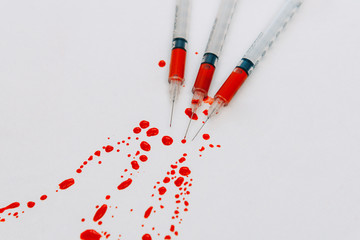 Treatment against addiction. Syringe with blood. Immunodeficiency.