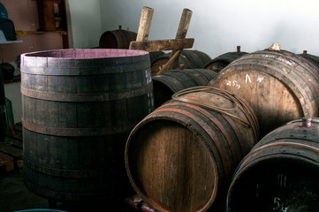 freshly-smoked sausages and wine in a barrel in a cellar for holidays