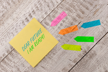 Word writing text Dear Future I Am Ready. Business photo showcasing suitable state for action or situation being fully prepared Plain note paper and line arrow stickers on the top of wooden table desk