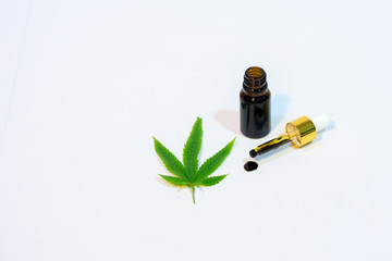 Medicinal cannabis with extract oil in a bottle isolated on white background