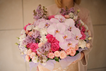 Lush bouquet of roses, irises and lilac