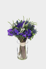 Beautiful bouquet with purple flowers close up