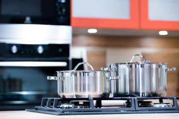 chrome pan on the gas cooking plate