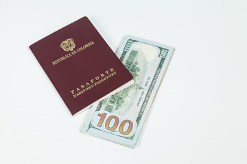 travel concept, Colombian passport with dollar bills for travel abroad