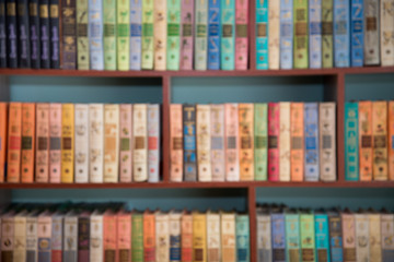 Blurred image of bookshelves in a public library. School library. Education concept