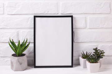 Empty  black frame mockup and succulents and cactus plants