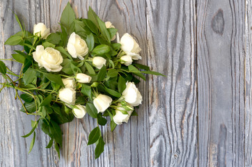 Roses on a wooden background