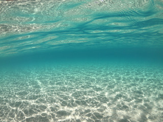 Underwater sea level photo of famous crystal clear turquoise sandy beach of Pori in Koufonisi island, Cyclades, Greece