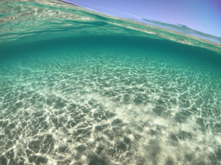 Fototapeta na wymiar Underwater sea level photo of famous crystal clear turquoise sandy beach of Pori in Koufonisi island, Cyclades, Greece