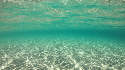 Underwater sea level photo of famous crystal clear turquoise sandy beach of Pori in Koufonisi island, Cyclades, Greece