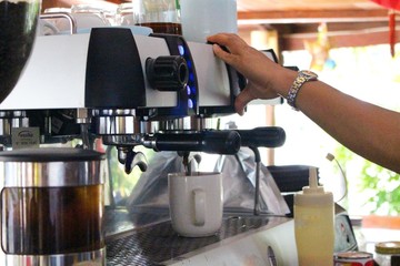  The staff are making coffee at the coffee maker