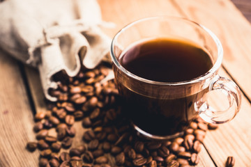 Cup of morning coffee on the rustic wooden background. Selective focus. Shallow depth of field.