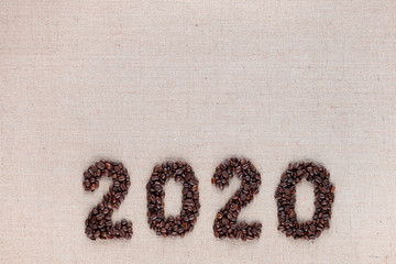 2020 writing from coffee beans, arranged bottom center