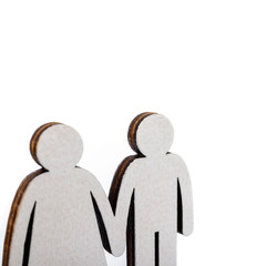 Family and couple concept. Wooden figures isolated on white.