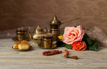 Still life with roses and coffee service