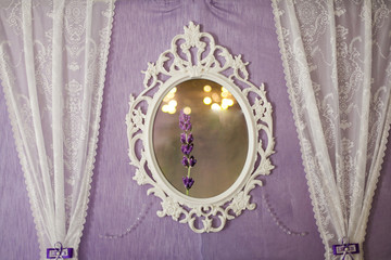 White vintage mirror on the wall. Close-up
