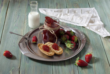 Breakfast of strawberry jam on rusks
