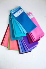 A Group of Twisted Colored Fabric on white