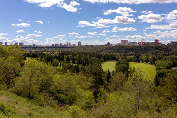 Fototapeta na wymiar City of Edmonton in Canada, view from the North Saskatchewan River and William Hawrelak Park in foreground