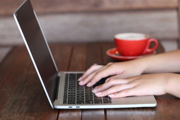 Fototapeta premium soft focus of young woman of freelancer working using laptop computer in coffee shop, Communication technology and Business concept
