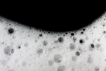 Foam bubbles abstract black background.