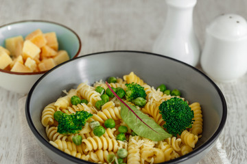 Pasta with broccoli and green peas