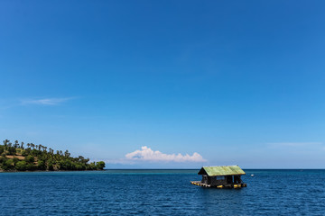 BALI, INDONESIA - December 01, 2013: Floating wooden House just off the coast of Lombok, Balis neighbouring Island.