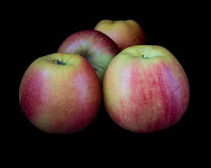 Ripe apples on black background