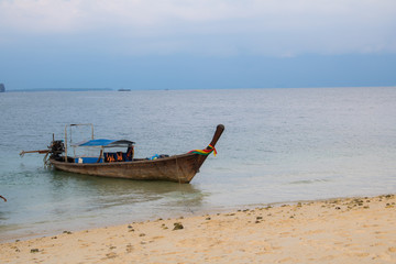Long tail boat on tropical beach with sky Evening sunlight