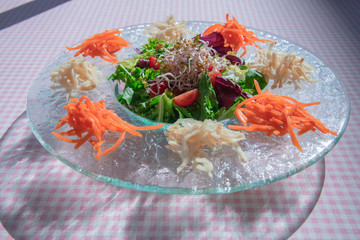 Assorted sprouts salad on a glass plate