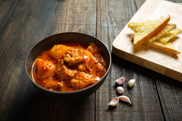 Goulash soup on wooden background.