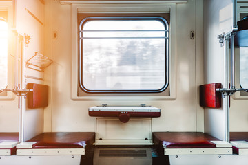 Empty passenger compartment in a moving train.