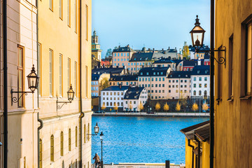 Touristic old street in Gamla stan is old town of Stockholm, Sweden. - obrazy, fototapety, plakaty