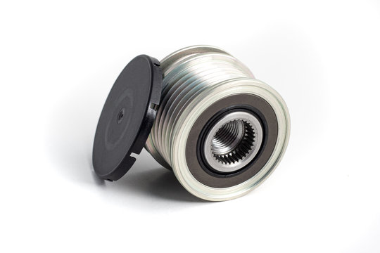 Freewheel alternator pulley on isolated white background with cap. Auto electrical parts.