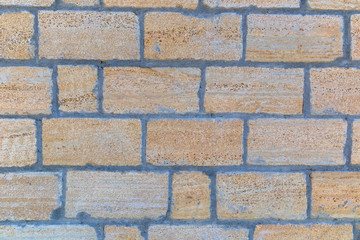 The texture of the wall of stone bricks