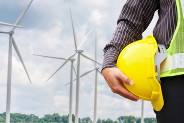 Engineer worker at wind turbine power station construction site