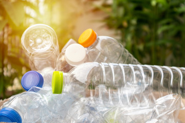 plastic bottles in brown recycle garbage box