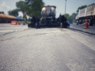 Road maintenance by burning old materials and improving quality