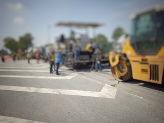 Road maintenance by burning old materials and improving quality - obrazy, fototapety, plakaty